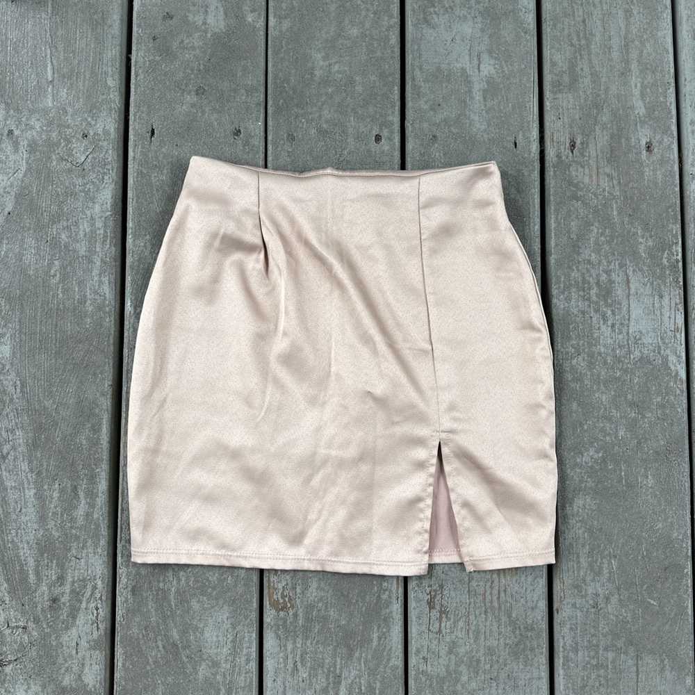 Cream satin mini skirt with a small slit
 Windsor